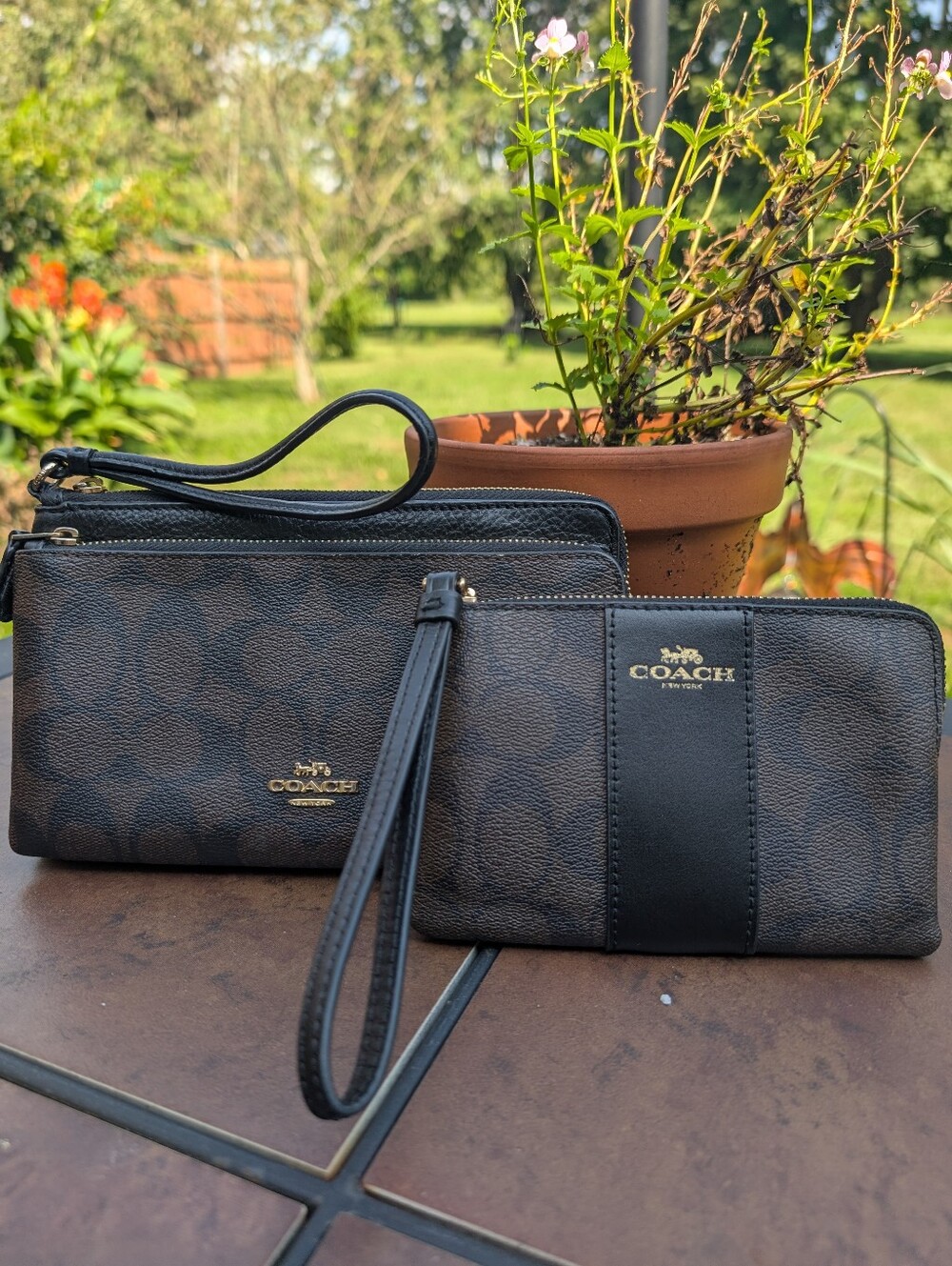 Two Coach Wristlets In Walnut Brown & Black W/Gold Hardware.